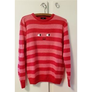 Striped sweater with face applique